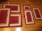 Group - 8 Matching Accent Rugs Non-Slip Backing Maroon w/ Beige Border Pile