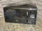 Black Oster 1100 Watts Counter Top Microwave Oven 1.1cu.ft w/ Preset Express Cook Selections
