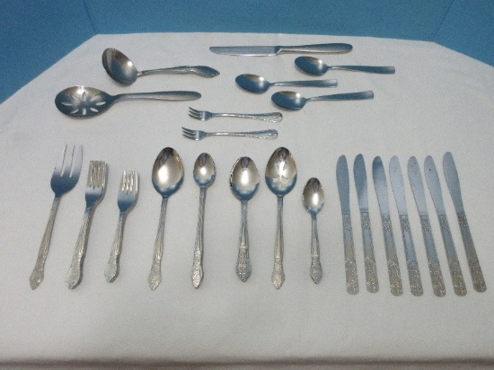 54 Pieces +/- Basic Stainless Flatware Floral & Scroll Motif