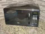Black Oster 1100 Watts Counter Top Microwave Oven 1.1cu.ft w/ Preset Express Cook Selections
