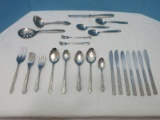 54 Pieces +/- Basic Stainless Flatware Floral & Scroll Motif