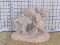 Pink Plaster figurine of girl helping boy onto horse, Engraved 