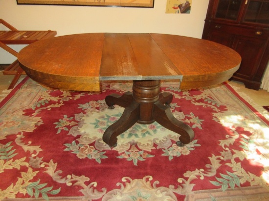 Grandiose Empire Style Tiger Oak Pedestal Table w/2 Leaves on Scroll Feet & Casters