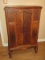 Depression Era Ornate Cabinet w/Double Sliding Panel Doors Applied Bellflower & Scroll Accent
