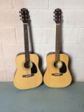 Two fender acoustic guitars.