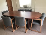 Conference table with six chairs .