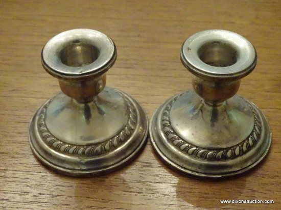 (DR) PAIR OF COLUMBIA STERLING WEIGHTED CANDLE HOLDERS. 2.75'' TALL