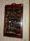 (K) SPOON COLLECTORS RACK W/ SPOONS FROM AROUND THE WORLD, 48 SPOONS TOTAL, JUST TO NAME A FEW,