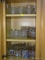 (K) CABINET LOT TO INCLUDE, FLINTSTONE GLASSES, WALT DISNEY GLASSES, AND MORE GLASS WARE