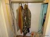 (FBB) CLOTHING HANGING IN CLOSET, CAMO PANTS, VESTS, GORE-TEX HUNTING PANTS