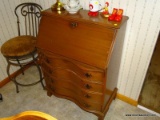 (K) MAHOGANY FALL FRONT DESK, HAS 4 SERPENTINE FRONT DRAWERS, DESK INTERIOR HAS PIGEON HOLES, 31''L,