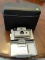 POLAROID LAND CAMERA IN HARD CASE. MODEL NO. 230. INCLUDES FLASH ATTACHMENT, SOME SYLVANIA FLASH