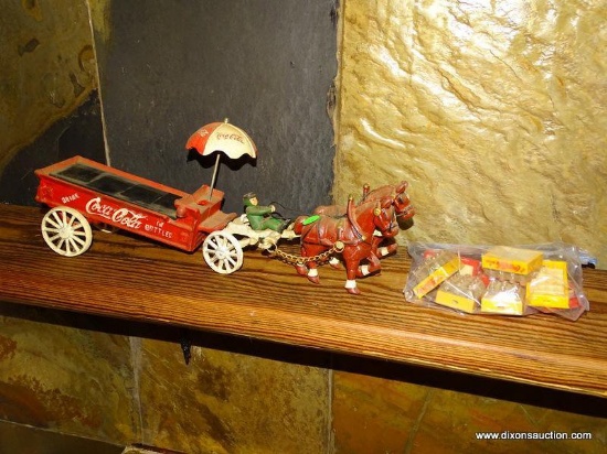 CAST IRON COCA COLA HORSE DRAWN DRINK WAGON BANK. HAS SMALL COCA COLA TRAYS WITH MINIATURE BOTTLES.