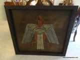 CARVED AND PAINTED NATIVE AMERICAN BIRD ON WOOD. IN CARVED FRAME: 40.5