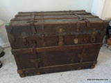 ANTIQUE SQUARE TOP WOOD, METAL AND CANVAS TRUNK WITH INTERIOR TRAY. HAS ORIGINAL LEATHER HANDLES AND