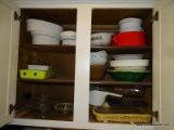 2 CABINET LOT (1 ABOVE REFRIGERATOR AND 1 BESIDE): CAKE TIN. BAKING DISHES. ETC.
