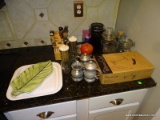 CONTENTS ON COUNTER BY DOOR: 3 PIECES OF PEWTER (2 CREAMERS AND SUGAR). GLASS CANISTERS. PAMPERED