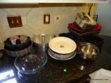 CONTENTS ON COUNTER BY SINK: MIXING BOWLS. PIE PANS. BUNT PANS. ETC.