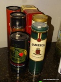 7 VARIOUS LIQUOR CONTAINERS: 4 ARE TIN. 2 ARE CARDBOARD. 1 IS PLASTIC. MOST ARE SCOTCH WHISKEY.