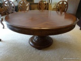 LARGE SINGLE PEDESTAL ROUND INLAID DINING TABLE WITH 1 LEAF (24'' WIDE). HAS A CARVED SKIRT. BASE