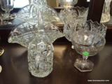 4 PCS OF MISC. GLASSWARE. INCLUDES A FLORAL COMPOTE 4.5'' DIA 5'' TALL, A PRESSED GLASS HANDLED