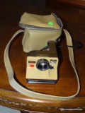 PRONTO POLAROID LAND CAMERA. INCLUDES MANUAL AND A SELF TIMER ATTACHMENT ALL IN LEATHER CASE