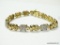 .925 STERLING SILVER & 14KT YELLOW GOLD OVERLAY ELEPHANT DESIGNED BRACELET. MEASURES APPROX. 8-1/4