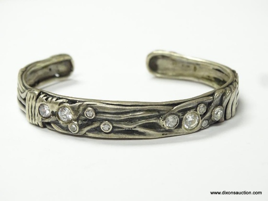 .925 STERLING SILVER LADIES HAND MADE CUFF BRACELET, STAMPED ISRAEL. FEATURES BEZEL SET CRYSTALS.
