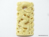 14.2 GRAMS, 71 CT CARVED DRAGON BONE. ORNATE CARVING IN HIGH RELIEF 2 7/8''X1.5''