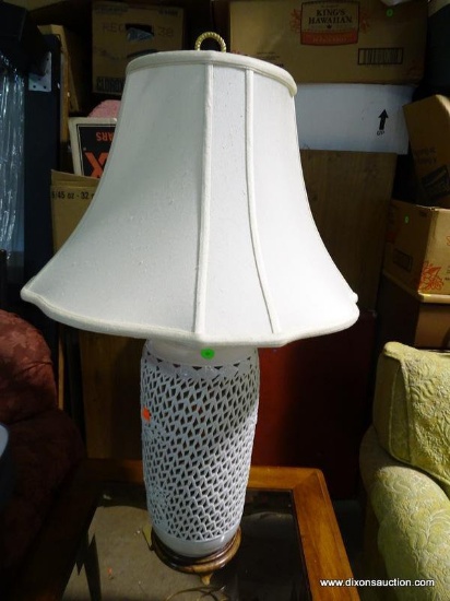 (W1) PORCELAIN RETICULATED ORIENTAL STYLE LAMP. HAS CLOTH SHADE: 8"x33". HAS FINIAL.