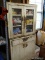 (G) VINTAGE WHITE METAL KITCHEN CABINET 2 DOORS OVER 1 DRAWER OVER 2 DOORS. POSSIBLY USED AS A