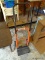 (S) SMALL 4 WHEEL HAND TRUCK. ORANGE AND BLACK IN COLOR