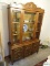(DR) CIRCA 1970'S FRENCH PROVENTIL BREAK FRONT WITH LIGHTED INTERIOR. 50''X16''X77''. IS 1 PIECE.