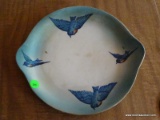 (K) ANTIQUE HAND PAINTED PLATE WITH 4 BLUE BIRDS ON IT. 10.25'' ACROSS. IS IN GOOD CONDITION