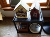 (K) 2 BIRD HOUSES. 1 IS DECORATED WITH FLOWERS AND THE OTHER IS DECORATED LIKE A BARN, ALSO INCLUDES
