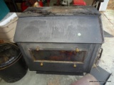 (G) CAST IRION WOOD BURNING STOVE WITH ATTACHMENTS. BRAND IS SIERRA. 30''X18''X26''. APPEARS TO
