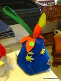 (LR) PLUSH PEAR WITH BROOCHES ATTACHED TO IT. 7 TOTAL BROOCHES.