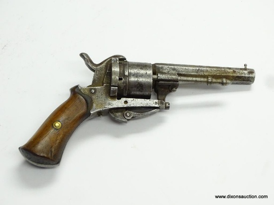 (SC) ANTIQUE 6 SHOT .25 CAL. REVOLVER. 7.5" LONG. OCTAGON BARREL. THE TRIGGER FOLDS FORWARD AND IS