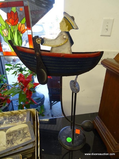 (A1) VINTAGE NAUTICAL MOTION DRIVEN TOY OF A SAILOR ROWING HIS BOAT. 17" TALL. WOULD MAKE A VERY