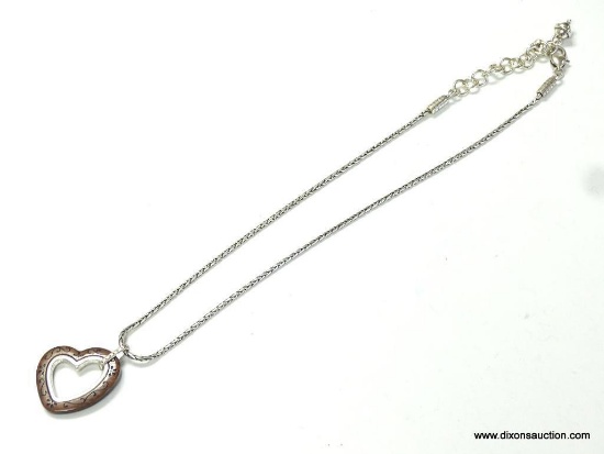 Brighton designer signed two-tone heart necklace measures 18 inches long with a 1.5 in heart