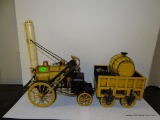 (S3) BLACK AND YELLOW 2 PIECE STEAM POWERED CAR WITH WAGON CONTAINING FIREWOOD. 18