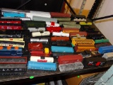 (S4) SHELF LOT OF ASSORTED HO SCALE CARS. 50+ CARS. OPEN STOCK. NO BOXES.
