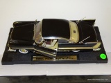 (S6) 1:18 SCALE 1958 PLYMOUTH FURY. BLACK WITH GOLD TRIM.