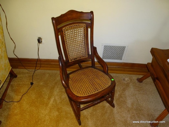 (LR) ANTIQUE VICTORIAN ROCKING CHAIR, HIP REST SIDES, CANE SEAT IN GOOD CONDITION, 19 1/2''L 32''W