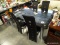 MODERN CHROME AND GLASS TOP DINING TABLE AND 4 VALENCIA CHROME AND FAUX LEATHER CHAIRS. GLASS TOP