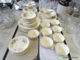 6 PIECE PLACE SETTING FOR 7 OF KNOWLES CHINA: 7 DINNER PLATES. 6 DESSERT PLATES. 7 CUPS AND SAUCERS