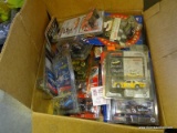 BOX OF NASCAR DIECAST MATCHBOX CARS. SOME WITH CARDS. BRAND NEW IN PLASTIC CASES. APPROXIMATELY 15+.