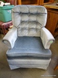 BUTTON TUFTED SWIVEL ARM CHAIR. SHOWS WEAR ON THE ARMS; 26