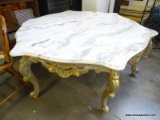 VERY LARGE MARBLE TOP HEAVILY CARVED BASED COFFEE TABLE. HAS LEAF CARVING AND FRENCH QUEEN ANNE
