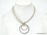 DAISY FUENTES SILVER-TONE DESIGNER NECKLACE WITH DOUBLE GRADUADTED CIRCLE PENDANT. MEASURES APPROX.